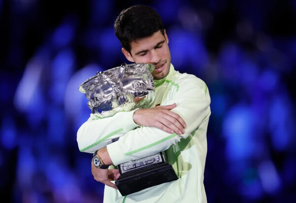 Carlos Alcaraz Lifting Champion Trophy After Defeating Novak Djokovic at the Australian Open 2026