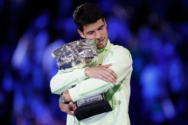 Carlos Alcaraz Lifting Champion Trophy After Defeating Novak Djokovic at the Australian Open 2026