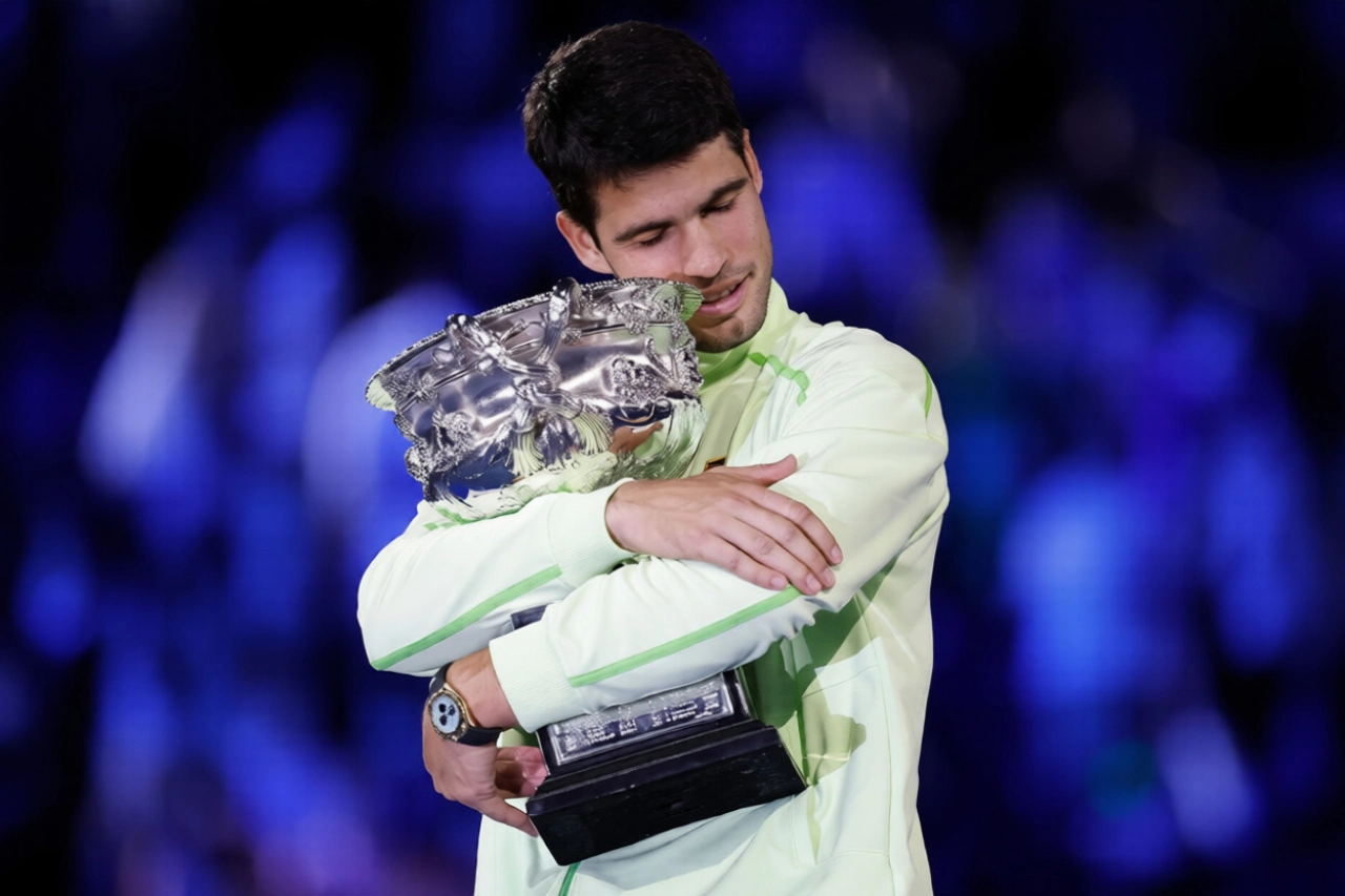 Carlos Alcaraz Lifting Champion Trophy After Defeating Novak Djokovic at the Australian Open 2026